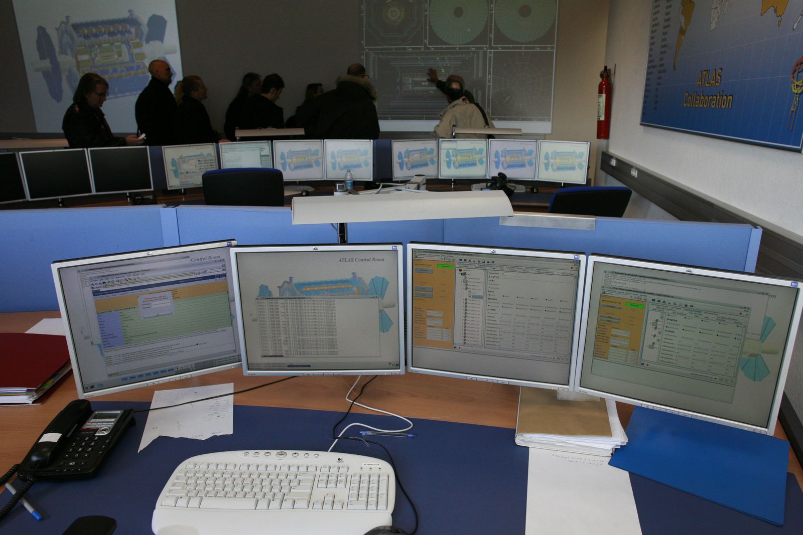 A wall of monitors displaying live data in a control room